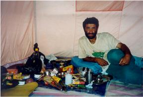 Arif in the mess tent about to cook our dinner .....